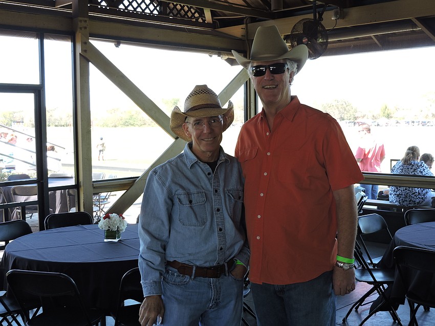 Matt Walsh, owner and CEO of the Observer Media Group, and Tampa'  s Joel Schleicher of  Focal Point Data Risk visit before the Observer Cup.