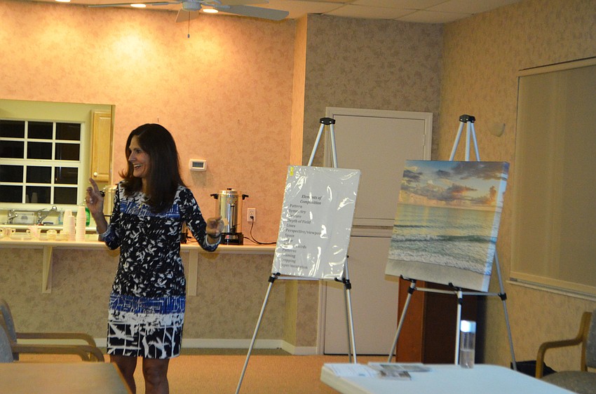 Mary Lou Johnson shared why she likes photographing water and “God’s work” so much with the club.