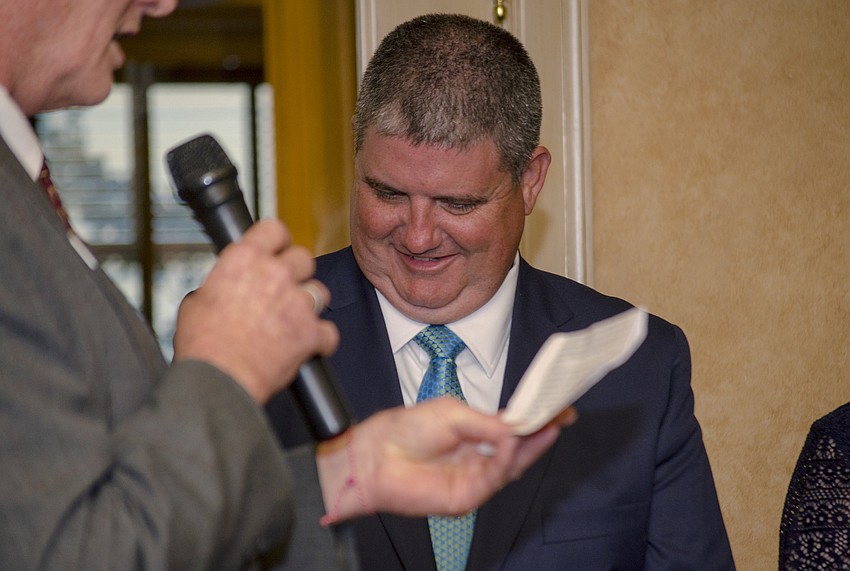 Superintendent Todd Bowden laughs while Senior Vice President for Community Investment for Gulf Coast Community Foundation Jon Thaxton introduces him.