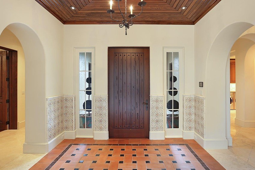 The arches, wood accents and tile form a magnificent entry.