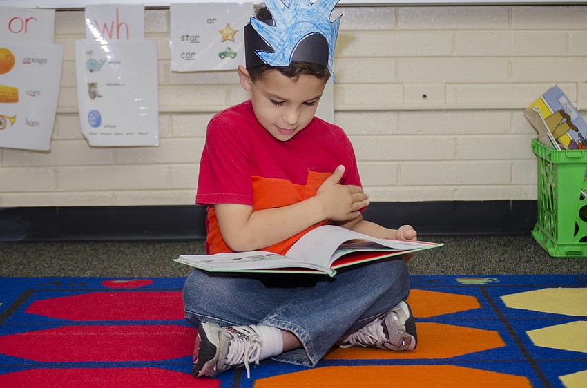 Daniel Izquierdo reads during Fruitville Elementary School'  s celebration of Dr. Seuss'  s 113th birthday. The school partnered with Embracing Our Differences to bring 11 readers to Fruitville classrooms.