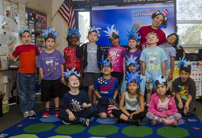 Yesenia Herrera poses with her kindergarten class. The class made their own Thing One and Thing Two hats earlier that day.