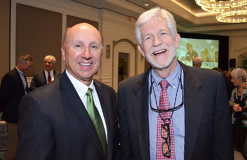 Gulf Coast Community Foundation President Mark Pritchett and Dennis McGillicuddy