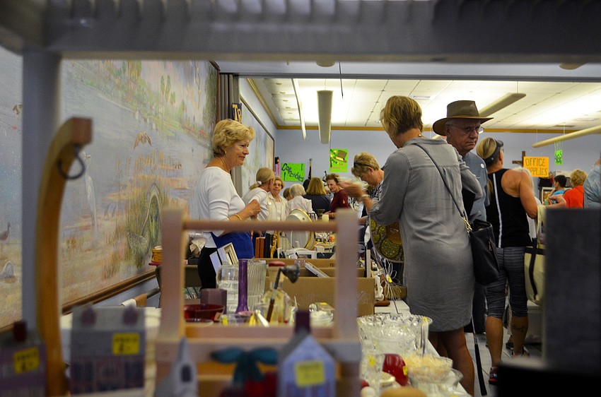The “Trash and Treasures” table was lined with customers looking for various household items.