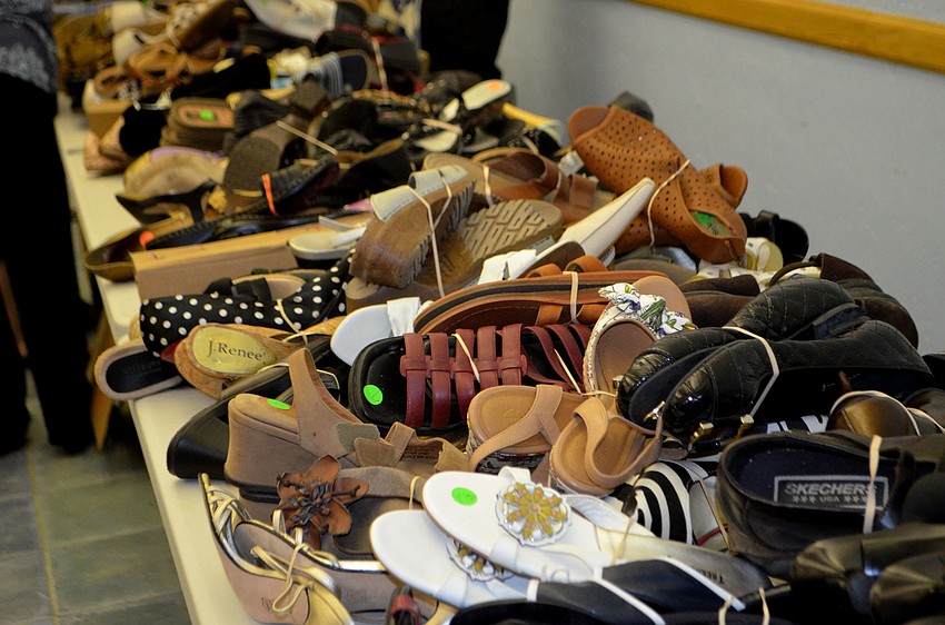 Next to the ladies’ clothing, shoes were spread out on two long tables.