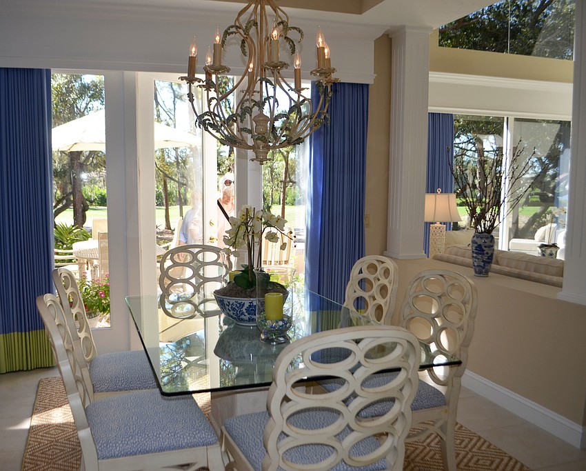 The dining room of the Flaherty home leads out to a patio on the Harbourside Golf Course.