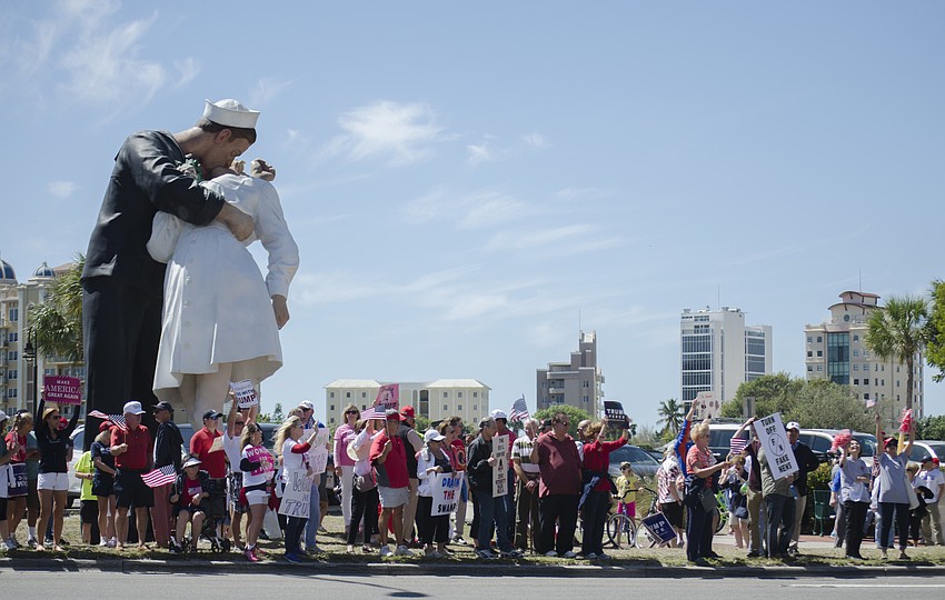 Demonstrators lined Bayfront Drive in front of the Unconditional Surrender statue.