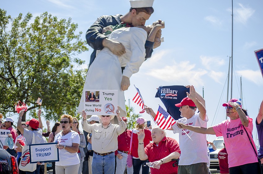 Demonstrators lined Bayfront Drive in front of the Unconditional Surrender statue.