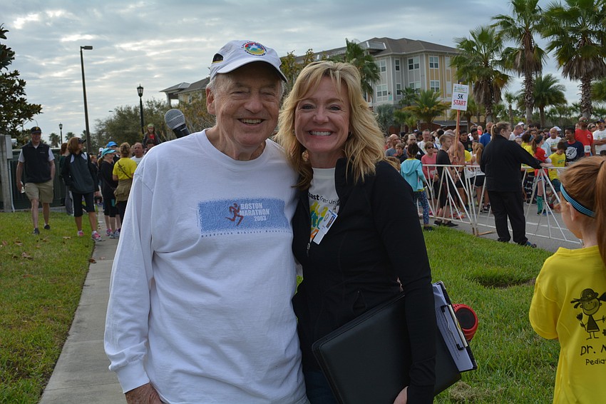 Race Director Doug Schiller joins Take Stock in Children Executive Director Diana Dill before the starting gun.