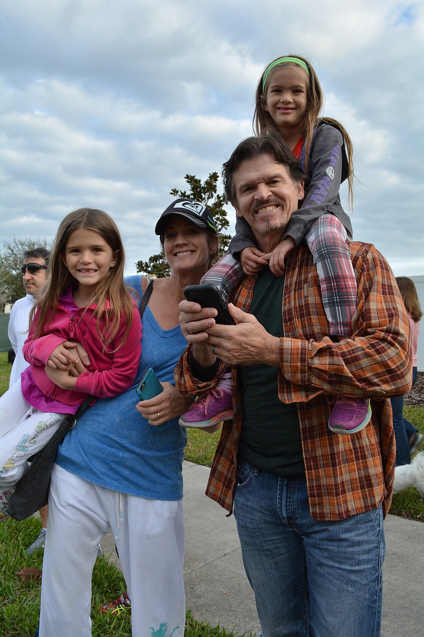 Bradenton'  s Lindy and Hank Taylor and their daughters, Ava, left, and Izzy, above, support their oldest daughter, Lola, who ran the 5K.