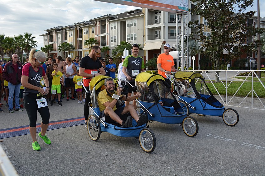 Individuals with disabilities take their spot in the run.