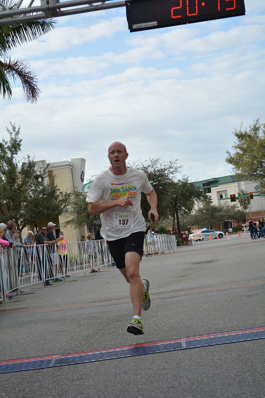 Lakewood Ranch'  s Mark Leatt finishes the 5K in just over 20 minutes.