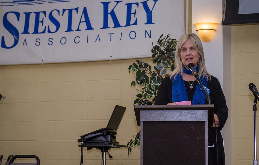 SKA Vice President Catherine Luckner welcomes guests to SKA'     s annual breakfast.