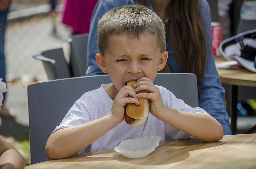 Wyatt Daniel eats a hotdog