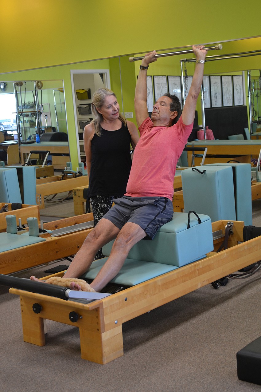 Rick Lieberman works out with his trainer Kathy Dandois Boivin at her studio, Dynamic Fitness.