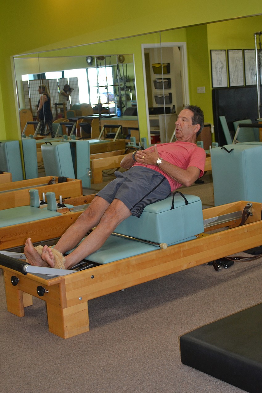 Rick Lieberman works out with his trainer Kathy Dandois Boivin at her studio, Dynamic Fitness.