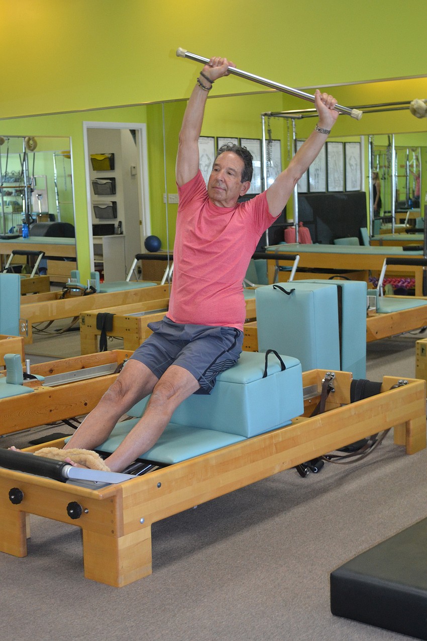 Rick Lieberman works out with his trainer Kathy Dandois Boivin at her studio, Dynamic Fitness.