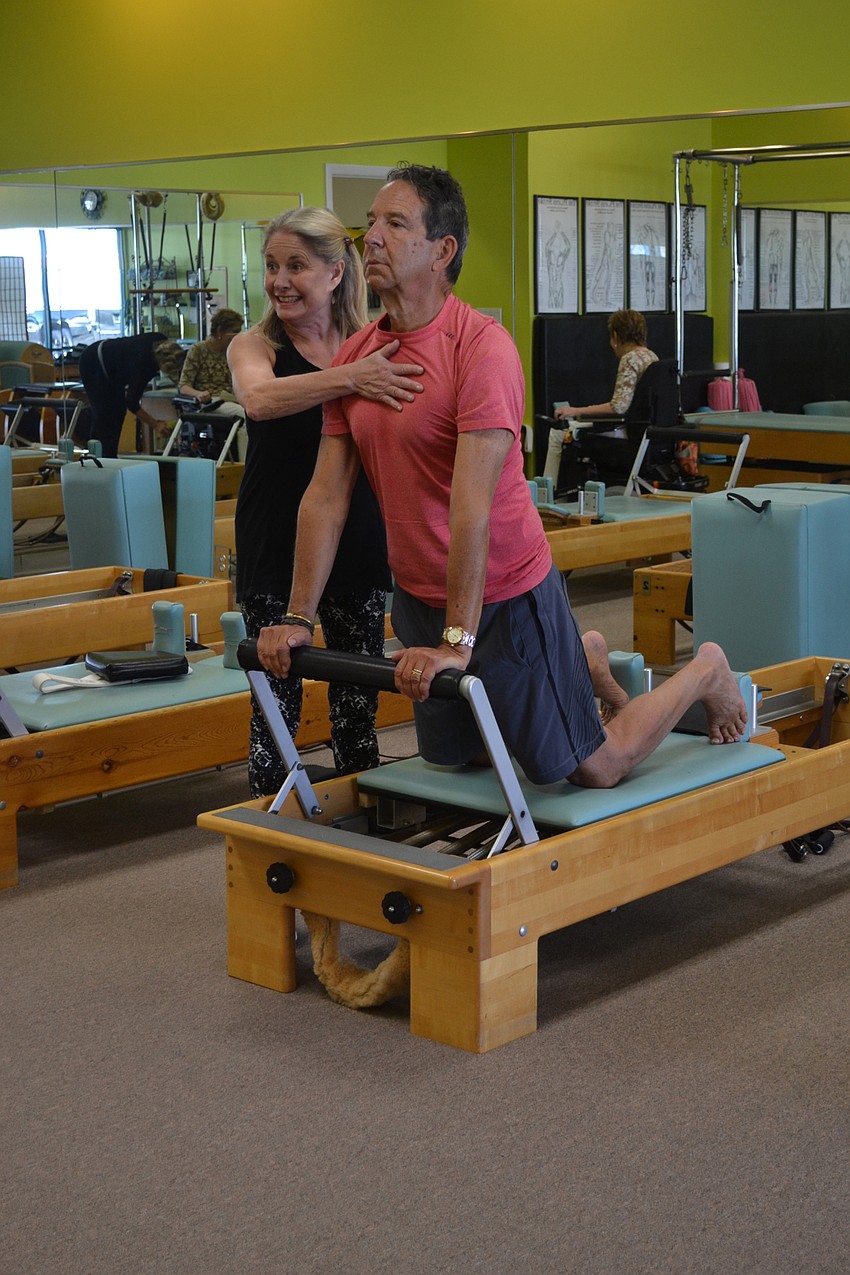 Rick Lieberman works out with his trainer Kathy Dandois Boivin at her studio, Dynamic Fitness.
