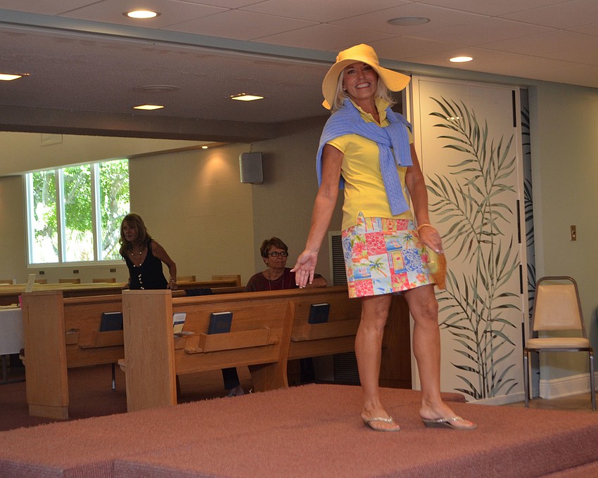 Holly Hennessy smiles for the camera as she models during the “Daytime Delight” portion of the fashion show.