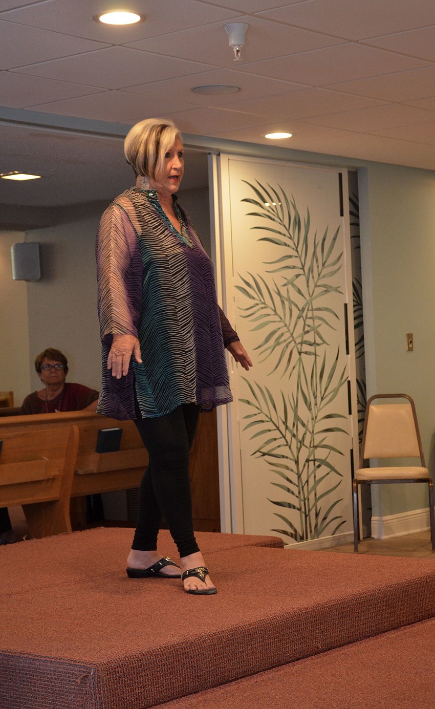 Olivia Gruen models a multi-colored tunic from the Lord’s Warehouse during the fashion show.