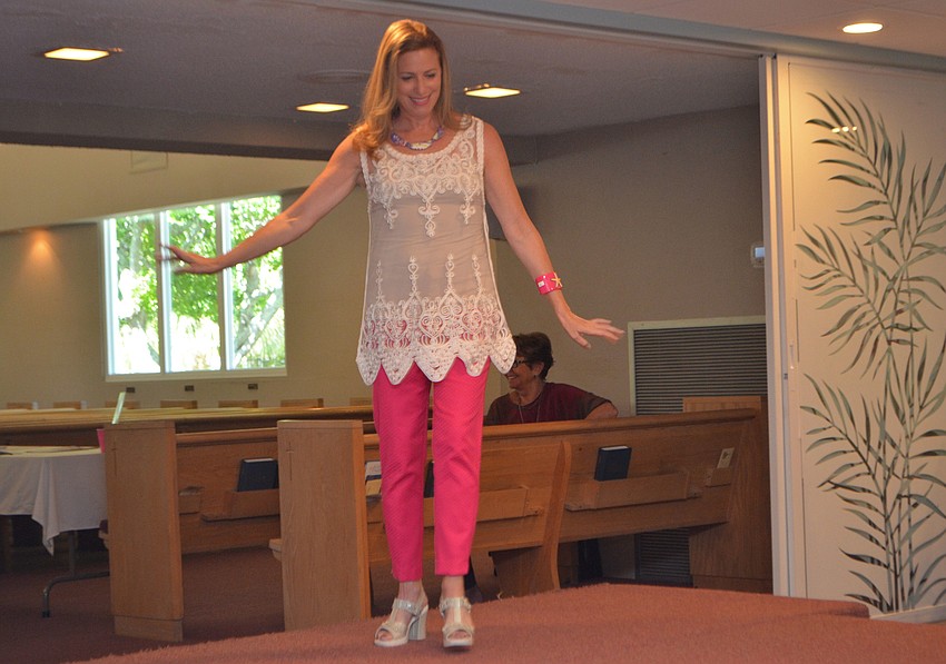 Suzy Brenner twirls for the crowd during the “Daytime Delight” portion of the fashion show.