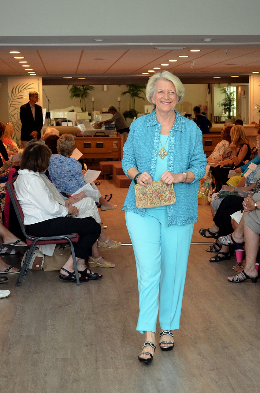 Liz Yerkes works the runway during the “Florida Fun” portion of the fashion show.