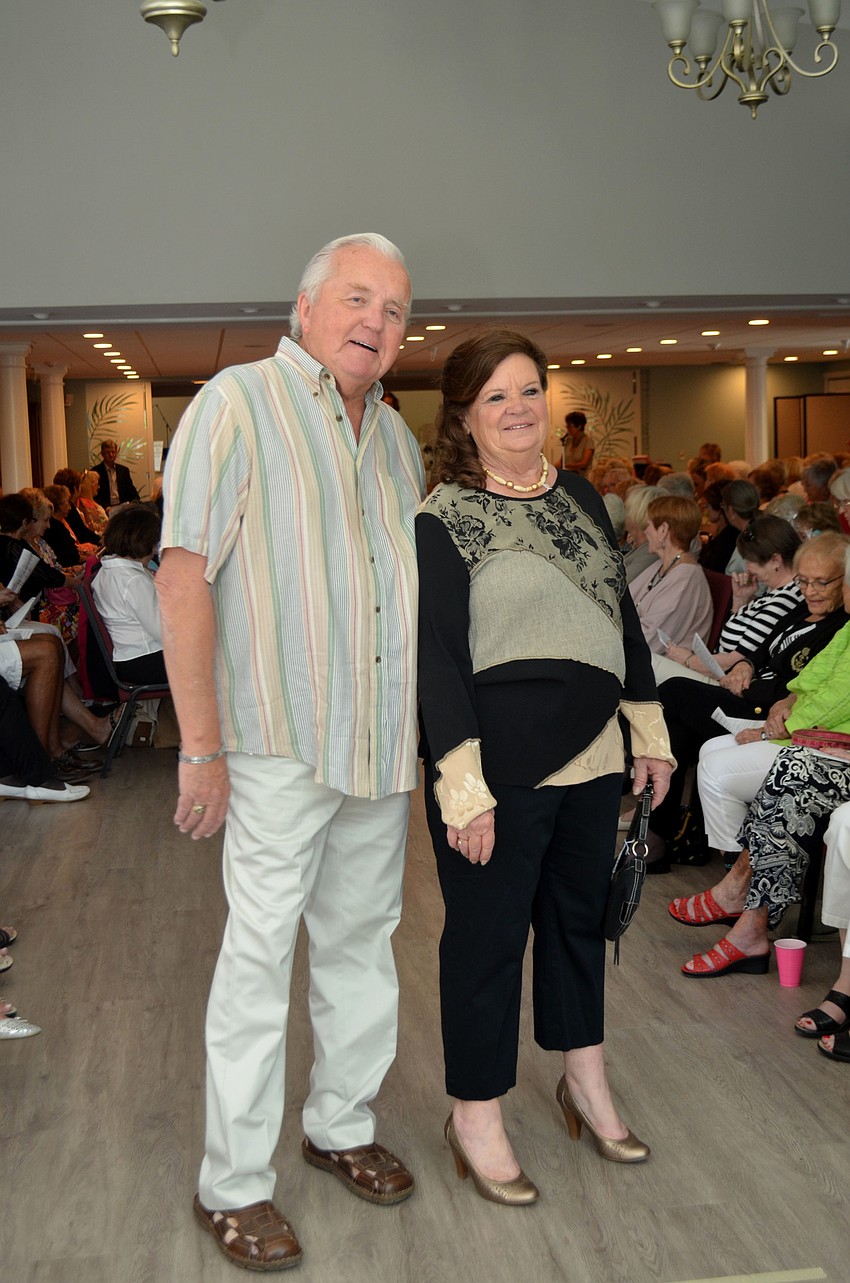 Charles Craig and Vicki Van Meier pose at the end of the runway.