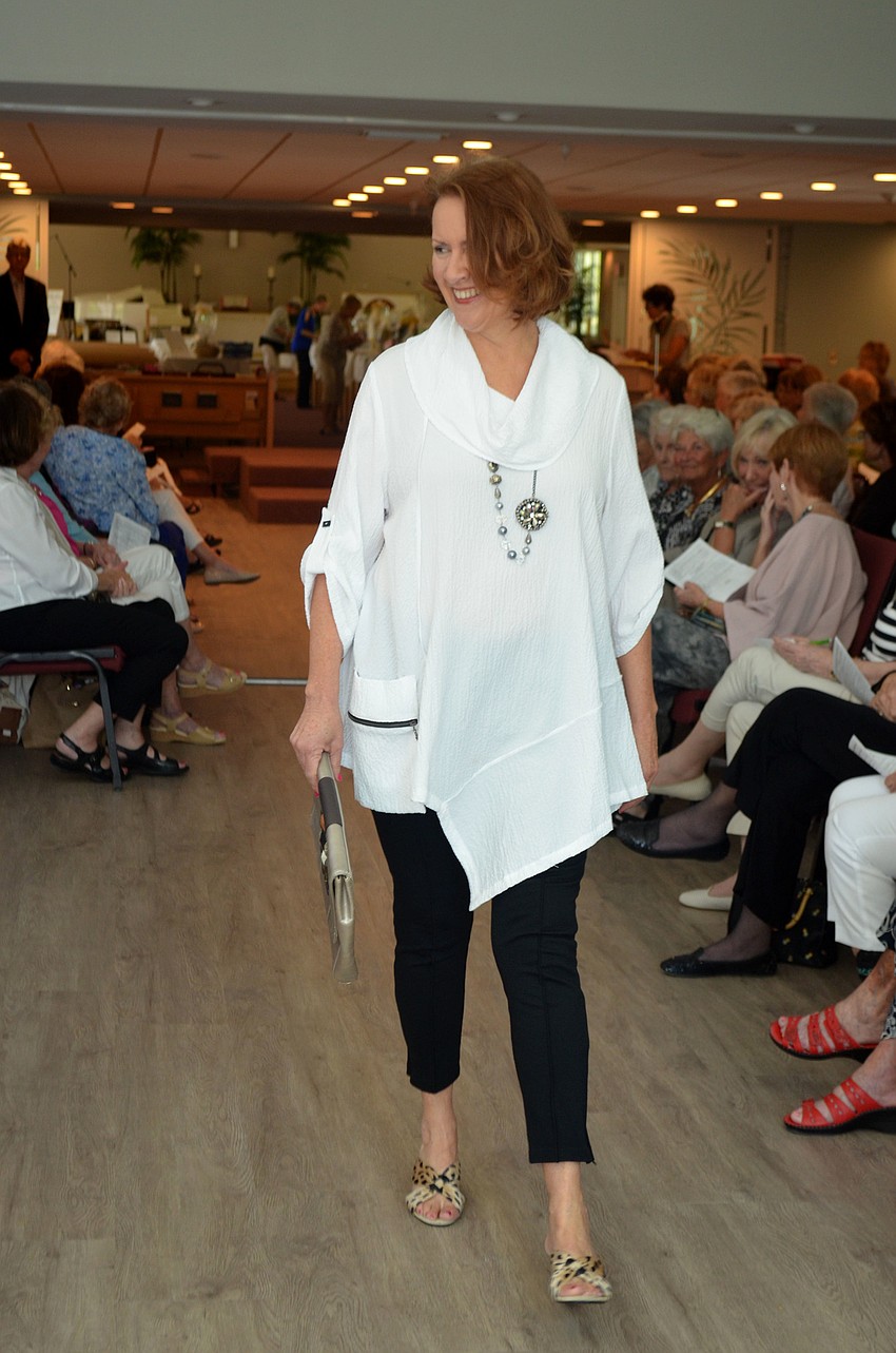 Gail Condrick smiles at the crowd during the “Florida Fun” portion of the fashion show.