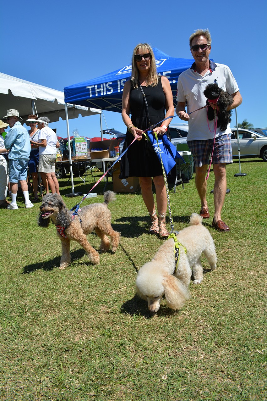 Lisa and Jerry Reeve, of Sarasota, bring their dogs, Jagger, Bowie and Angie.