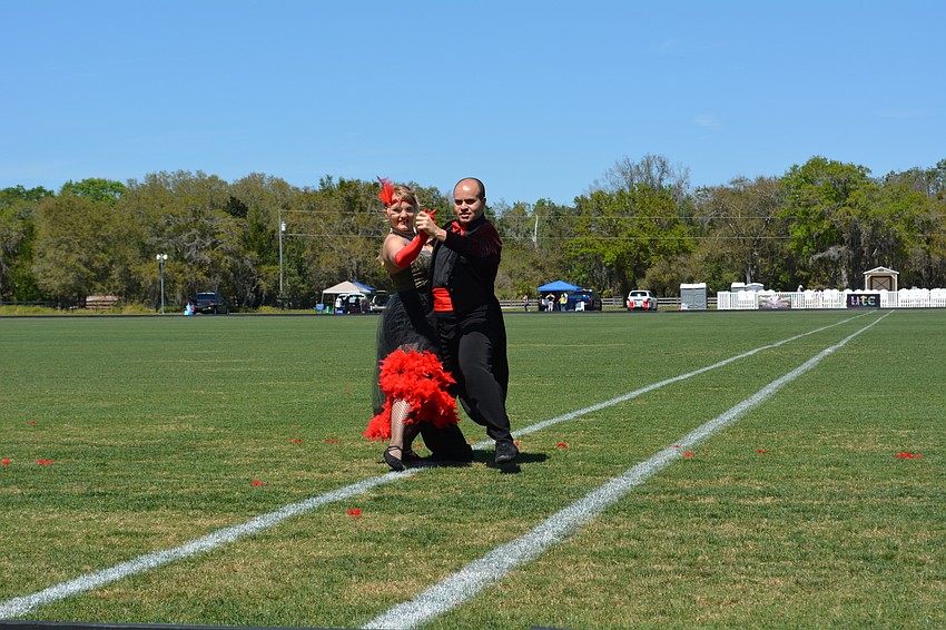 Dancers from Fred Astaire Dance Studio perform before the match.