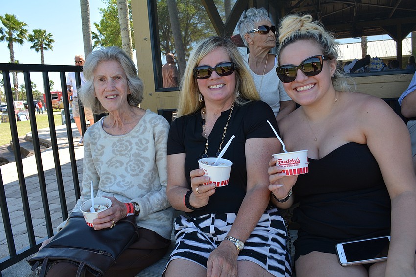 Longwood Run residents Nancy Collins, Kathryn Collins and Rachel Westheimer — grandmother, daughter and granddaughter — cool off with ice cream.