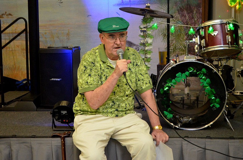 The Rev. Gerry Finegan sang a song for everyone after the raffle winners were announced.