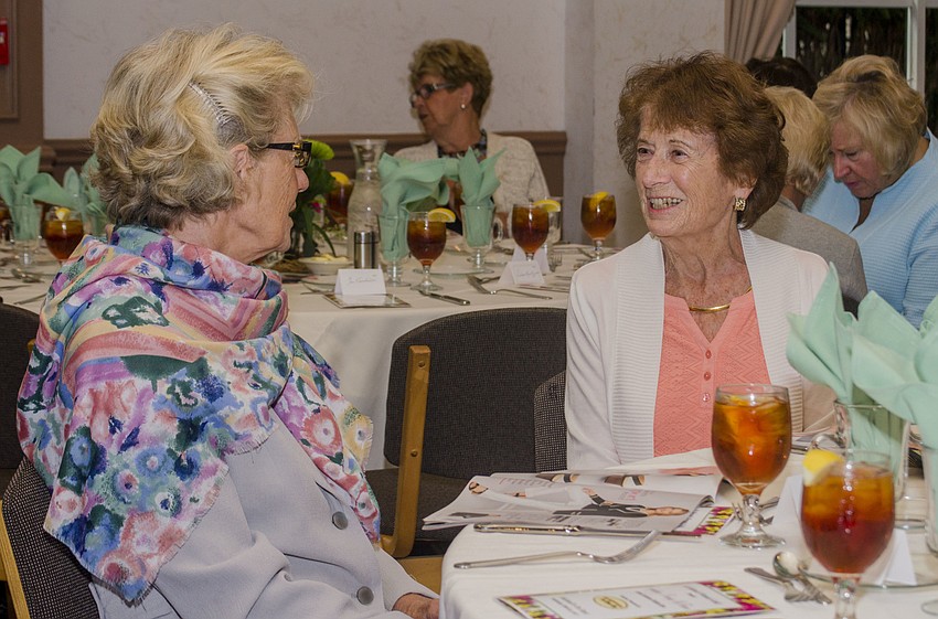 Joyce Renzi and Sharon Harris chat during the drinks and silent auction portion of the event.
