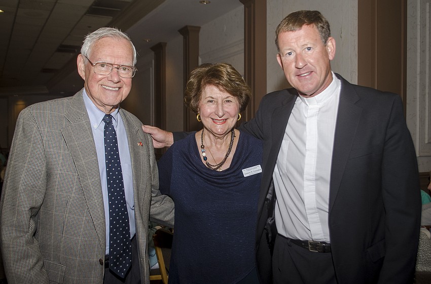 Stan Abshier, event chairwoman Antonette Cunningham and the Rev. Michael Cannon