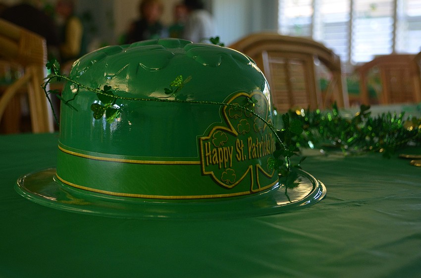 Hats and gold coins decorated each table in the clubhouse.