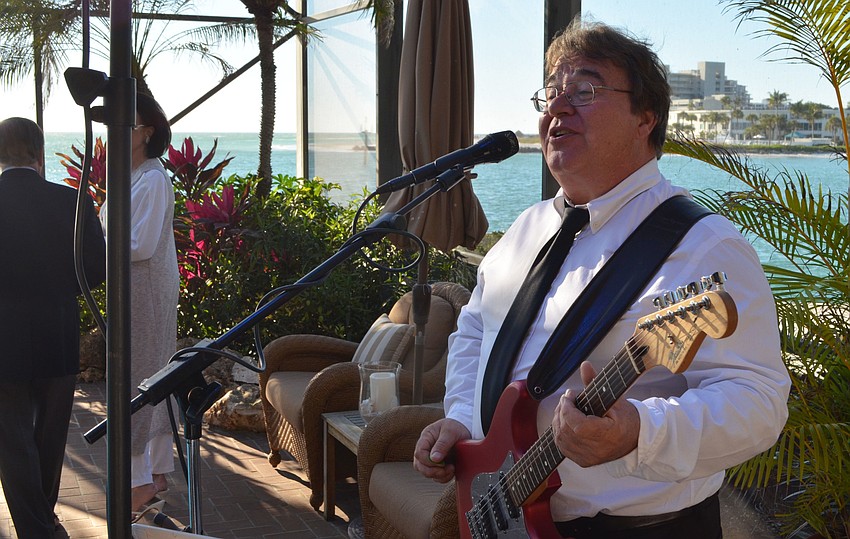 John Rinell performs for guests.