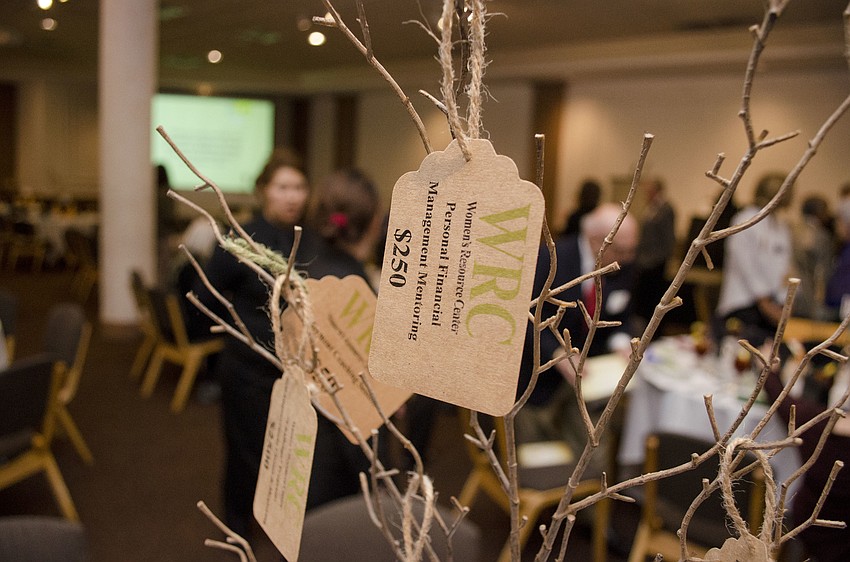 The tree-like centerpieces on each table at the Women’s Resource Center Annual Renaissance Legacy Luncheon on March 21 at Michael’s On East had tags noting how donations of various amounts would benefit the WRC.