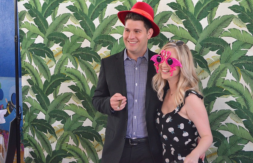 Amanda and Dan Tullidge pose in the photobooth at Party on the Pass: “Hot Night in Old Havana” on March 24 at Mote Marine Laboratory & Aquarium.