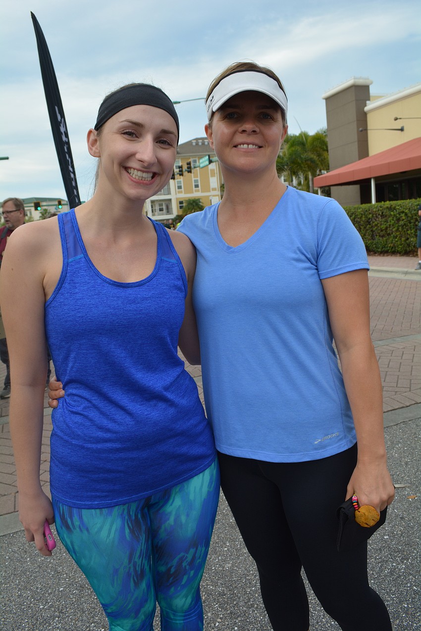 Natalie Chisholm , of Palmetto, runs with Julie Emrick, of Lakewood Ranch.