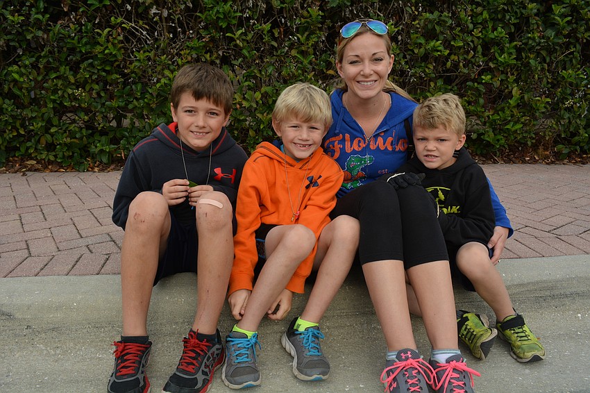 Petyon, Chase, Sarah and Blake Willis cheer on Levi Willis, of Parrish.