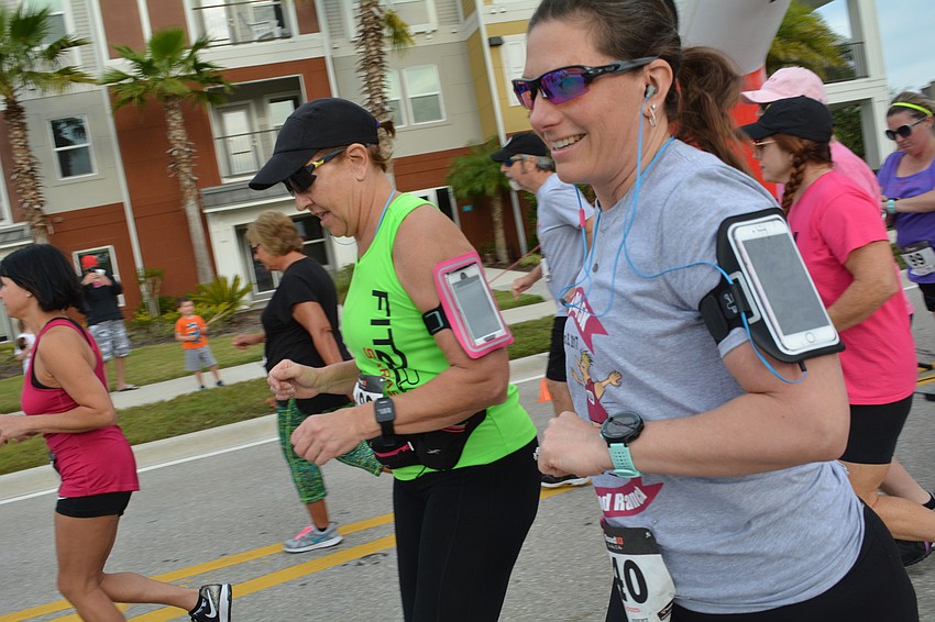 Ivy Pena, visiting from Illinois, runs with her husband, Victor Pena.