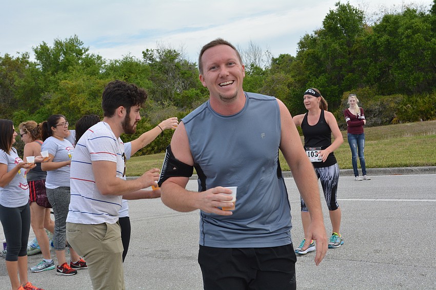 Matt Maurer makes sure to snag his cup of beer at the halfway point.