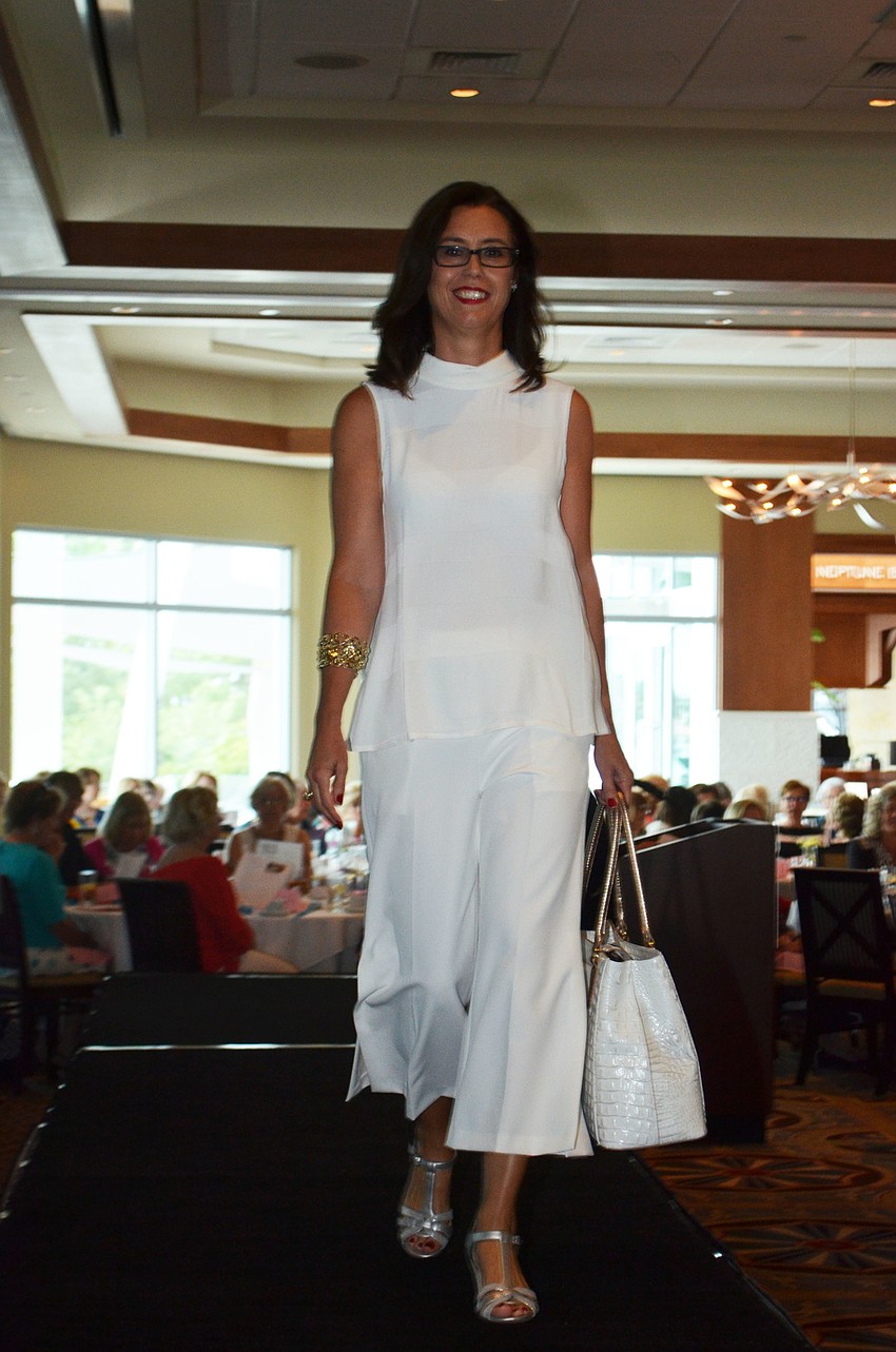 Maureen Watterson is a vision in white as she walks the runway.