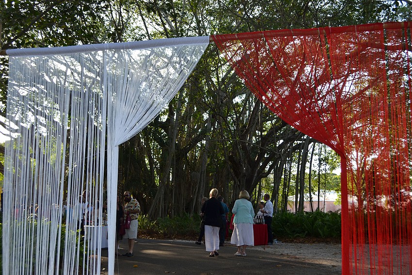 Guests walk through the banyan canopy at the 5th annual Wine Walk to Ca’ d’Zan on March 31 at The Ringling.