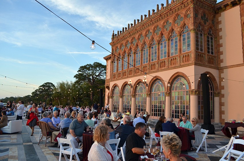 Guests enjoy drinks on the terrace of the mansion at the 5th annual Wine Walk to Ca’ d’Zan on March 31 at The Ringling.