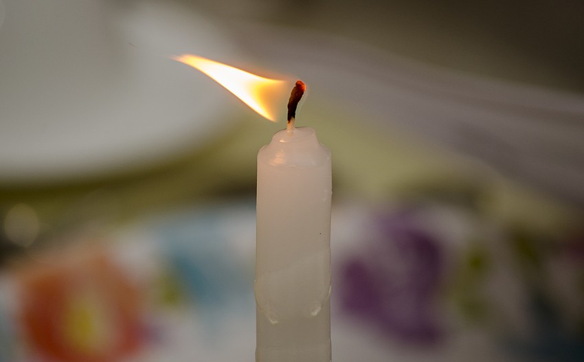 Participants lit candles at the beginning of the ceremonial meal.
