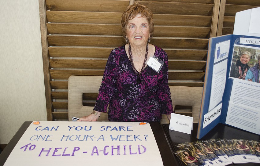 Ann Hartka assumes her usual position at the volunteer table at the Compeer Luncheon on April 6 at The Francis.
