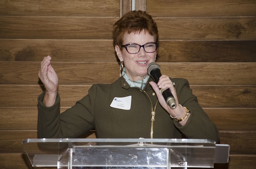 Compeer Sarasota Services for Adults and Children Director Lynn Buehler explains how Compeer volunteers and clients “lift eachother up” while speaking at the Compeer Luncheon on April 6 at The Francis.