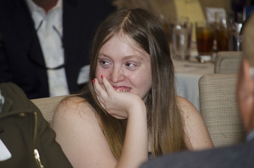 Ashley W. watches her Compeer Sarasota “match,” Niki Kottmann, speak about their friendship at the Compeer Luncheon on April 6 at The Francis.
