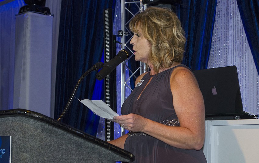 Kathie Musto, president of the Neuro Challenge Board of Directors, addresses the crowd at A Night Under the Stars on April 7 at Michael’s On East.